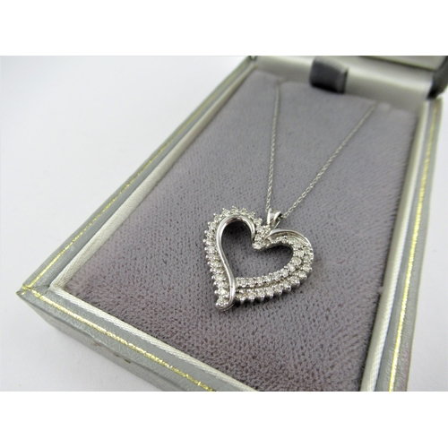 10ct White gold diamond set heart shaped pendant on a 10ct white gold chain