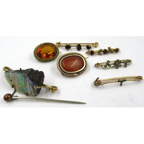 1365 - Three 9ct gold bar brooches, a 19th Century oval gold cabochon agate brooch, another oval citrine br... 