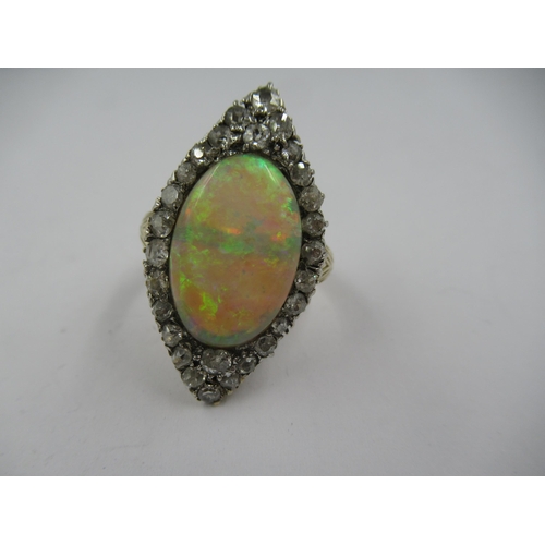 1386 - 18ct Yellow gold marquise ring set oval opal surrounded by diamonds, the opal approximately 17mm x 1... 