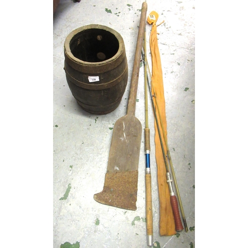 139 - Wooden metal banded barrel, a paddle and two fishing rods