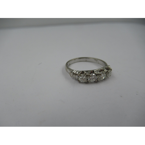 1418 - 18ct White gold four stone diamond ring, size 'L'