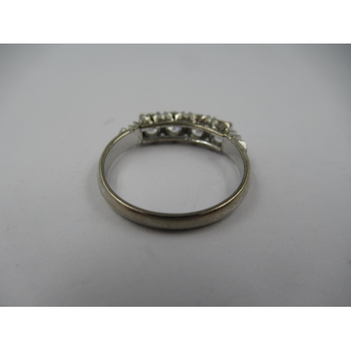 1418 - 18ct White gold four stone diamond ring, size 'L'