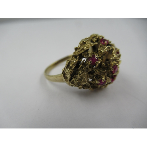 1428 - 9ct Yellow gold ruby set cluster dress ring, size 'M'