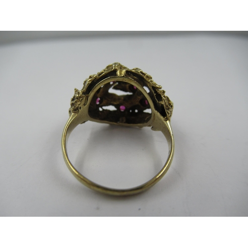 1428 - 9ct Yellow gold ruby set cluster dress ring, size 'M'