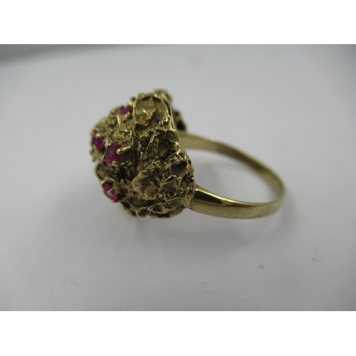 1428 - 9ct Yellow gold ruby set cluster dress ring, size 'M'