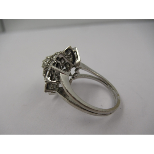 1429 - French 18ct white gold diamond set star shaped cocktail ring, size 'K'