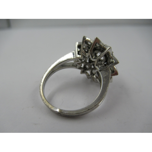 1429 - French 18ct white gold diamond set star shaped cocktail ring, size 'K'