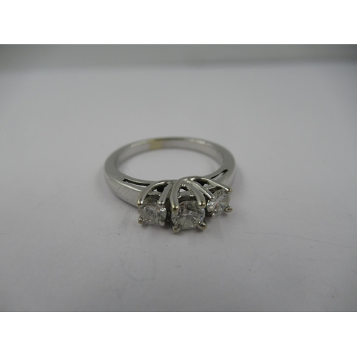 1432 - 14ct White gold ring set three brilliant cut diamonds, size 'K'