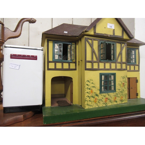 148 - Mid 20th Century Tri-ang dolls house with a quantity of period furniture, together with a dolls Hoov... 