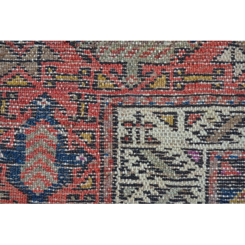 15 - Kurdish rug with a triple medallion design in shades of rose, beige and dark blue, 6ft 6ins x 3ft 6i... 