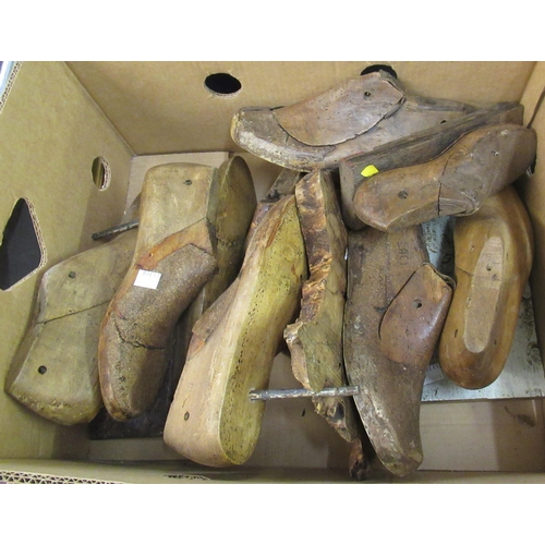 157 - Box containing a quantity of antique wooden shoe trees