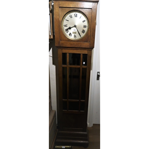 1914 - Early to mid 20th Century oak longcase clock, the circular silvered dial with Roman numerals and thr... 