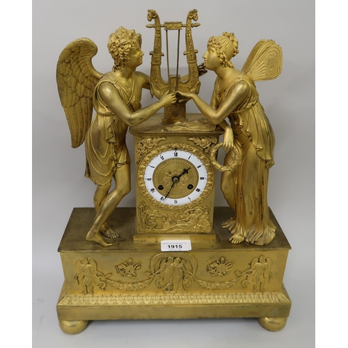 1915 - Early 19th Century French ormolu mantel clock, the circular enamel dial flanked by two figures of an... 