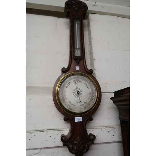 1924 - Late Victorian carved oak aneroid barometer/thermometer, the silvered dial inscribed Negretti and Za... 