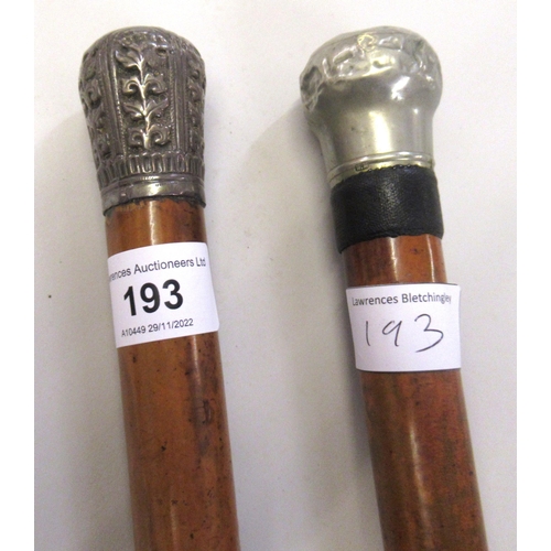 193 - Lacquer walking cane with an oriental white metal pommel, another similar walking cane and a World W... 