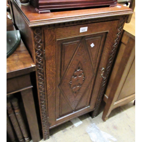 2052 - Oak side cabinet with a single carved rectangular panel door on stile supports, 20.5ins wide