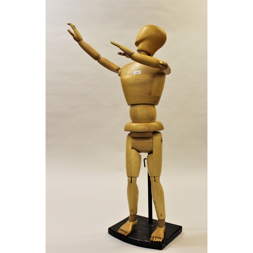 2054 - Medium artist's wooden articulated ley figure, 47ins high