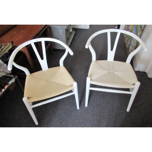 2309 - Pair of white lacquered wishbone type Charles Hansen style chairs with string seats, raised on turne... 