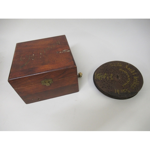 2329 - Small mahogany cased polyphon with various discs, discs 6.5ins diameter