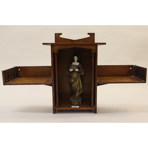 2332 - Arts and Crafts oak wall bracket, together with a gilded metal and ceramic figure of a girl carrying... 