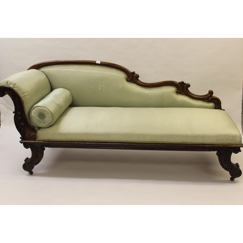 2336 - Victorian rosewood chaise longue, the shaped carved back above a carved scroll end and carved scroll... 