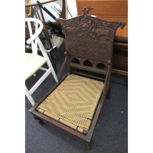 2337 - Indian carved hardwood low seat chair with string seat