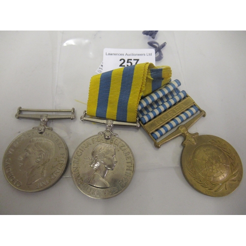 257 - Group of three Korean medals with ribbons