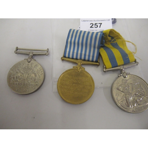 257 - Group of three Korean medals with ribbons