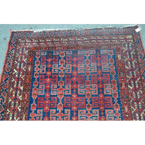 27 - Kurdish rug with an all-over hooked medallion design on a deep blue ground with multiple border, 6ft... 