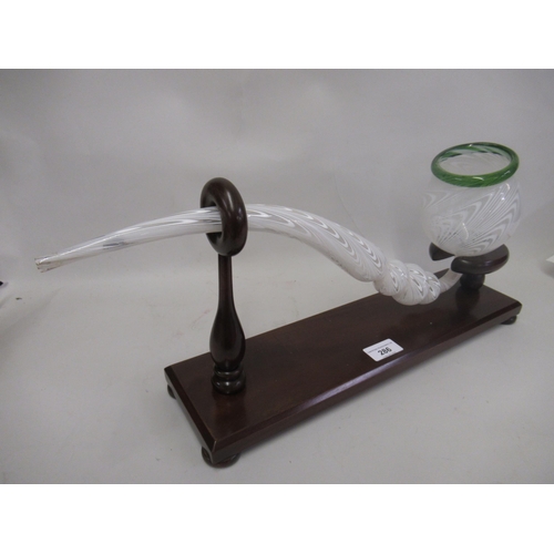 286 - Large Nailsea type glass pipe on a wooden stand