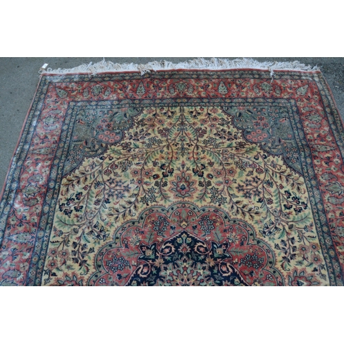 34 - Indo Persian rug with a medallion and all-over stylised floral design in shades of deep blue, pink a... 