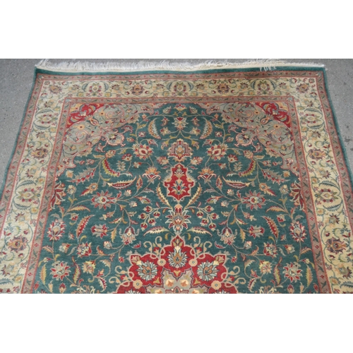 38 - Indo Persian rug with  lobed medallion and all-over stylised floral design on a blue / green ground ... 