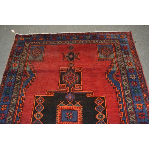 40 - Hamadan rug with a lobed medallion design on a wine red ground with border designs, 6ft 10ins x 4ft ... 