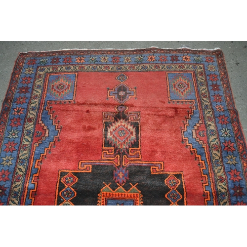 40 - Hamadan rug with a lobed medallion design on a wine red ground with border designs, 6ft 10ins x 4ft ... 