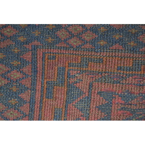 41 - Afghan Belouch rug having two rows of six hooked medallions with multiple borders on a burgundy and ... 