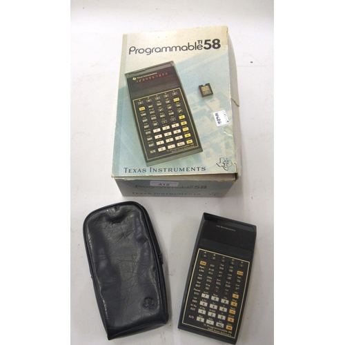 412 - TI-58 Programmable calculator in original box, including original charger, instruction book and prog... 