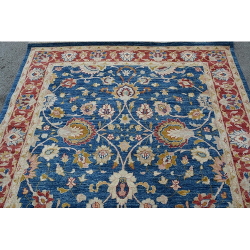 49 - Small Afghan Ziegler design carpet with an all-over palmette design on a blue ground with red ground... 