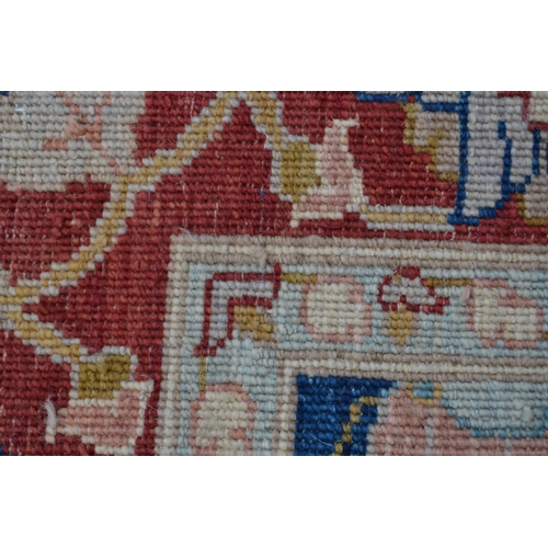 49 - Small Afghan Ziegler design carpet with an all-over palmette design on a blue ground with red ground... 