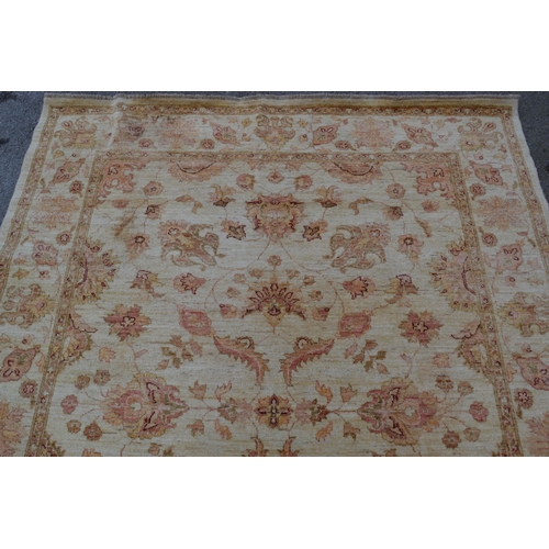 50 - Afghan Ziegler carpet with an all-over stylised floral design on a beige ground with borders, 8ft 1i... 