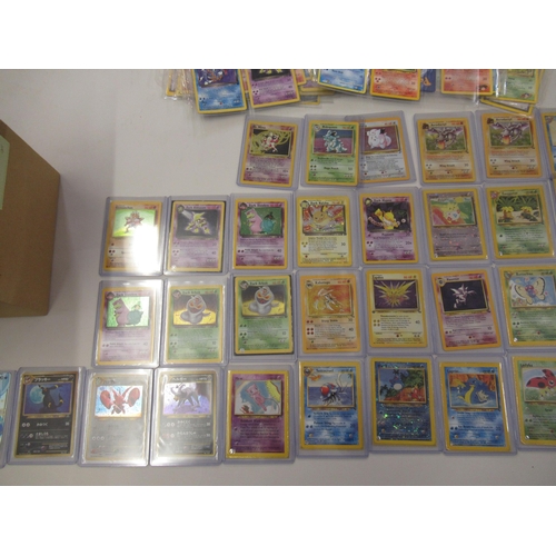 517 - Box containing a large quantity of Pokemon cards including Base set, Jungle, Fossil and Team Rocket ... 