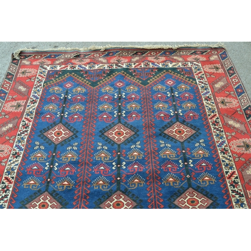 52 - Modern Belouch design carpet with a triple hooked panel design on a blue ground with multiple border... 