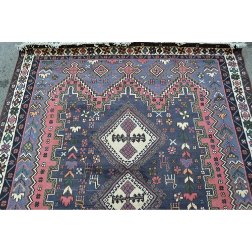 53 - Modern Persian Belouch style carpet with a triple hooked medallion, floral and bird design in shades... 