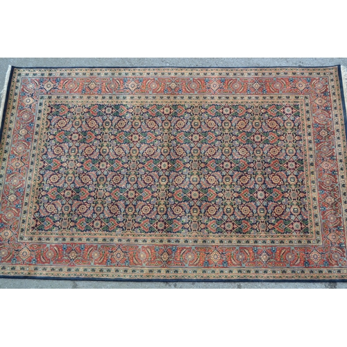 61 - Indo Persian rug with an all-over Herati design on a midnight blue ground with brick red borders, 8f... 