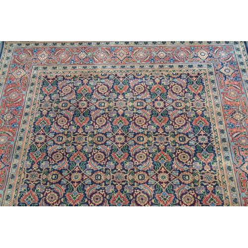 61 - Indo Persian rug with an all-over Herati design on a midnight blue ground with brick red borders, 8f... 