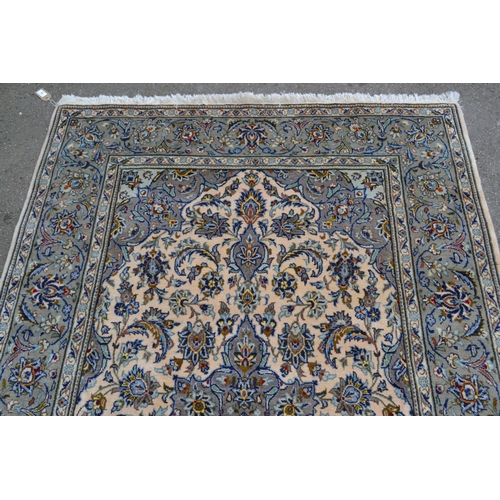 64 - Indo Persian rug with a lobed medallion and all-over stylised floral design on an ivory ground with ... 