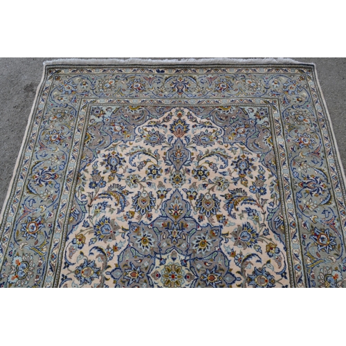64 - Indo Persian rug with a lobed medallion and all-over stylised floral design on an ivory ground with ... 