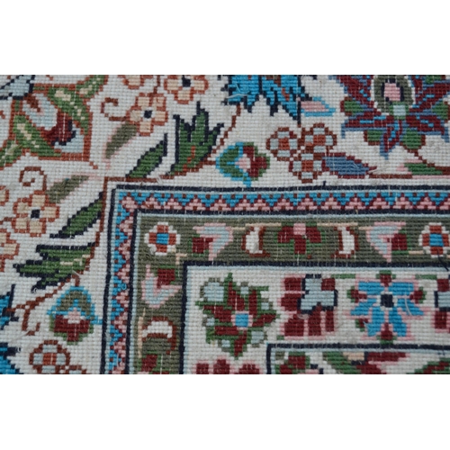 68 - Modern Qum style rug with a lobed medallion and all-over palmette design on a deep red ground, with ... 