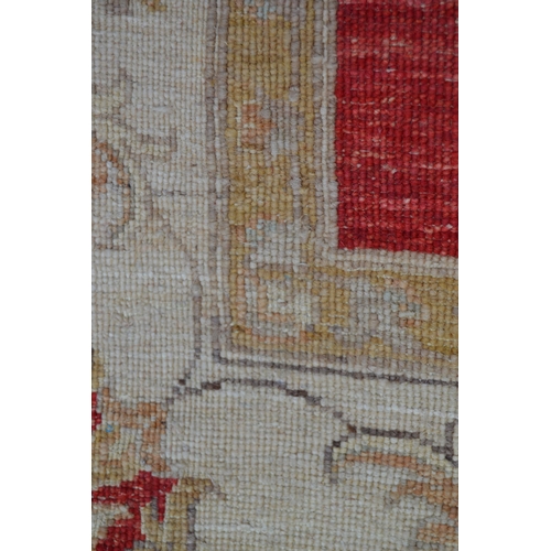 70 - Modern Afghan Ziegler design rug with an all-over palmette pattern on a red ground with beige ground... 