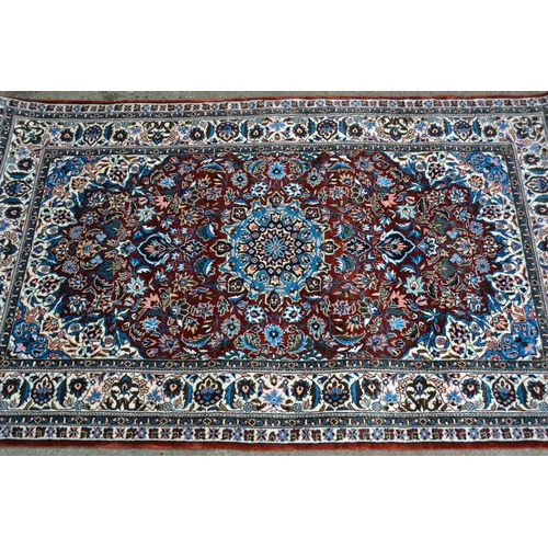 71 - Small modern Persian silk rug with a lobed medallion and all-over stylised floral design on a rust g... 