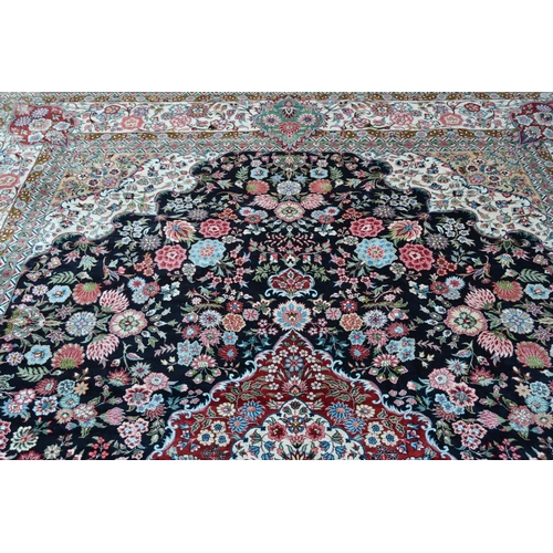 73 - Fine quality modern Persian silk carpet with a lobed medallion and all-over stylised floral design o... 